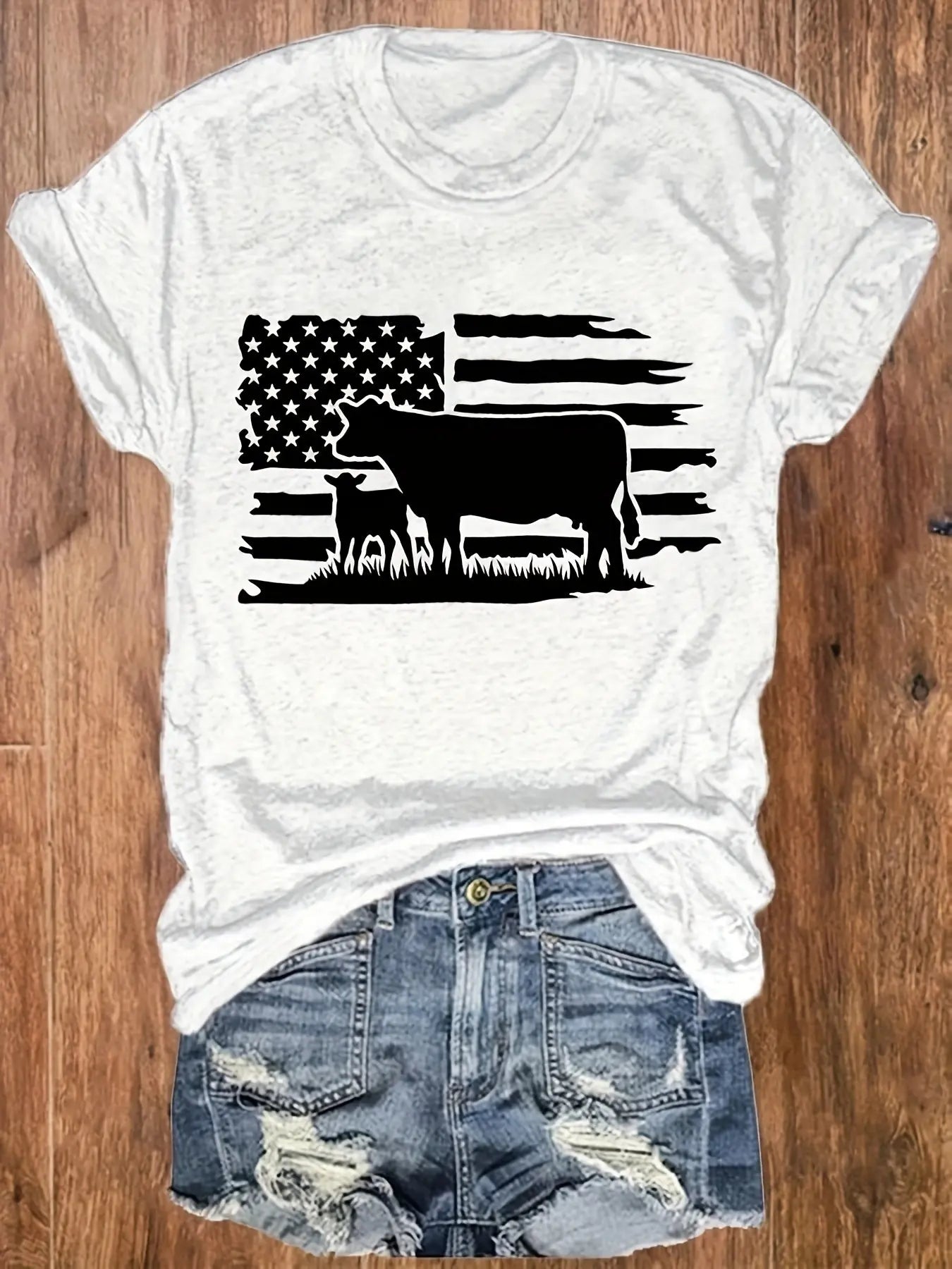 https://alittledisandat.com › products › vibrant-american-flag-cattle-print-womens-tshirt1725643557849 image1