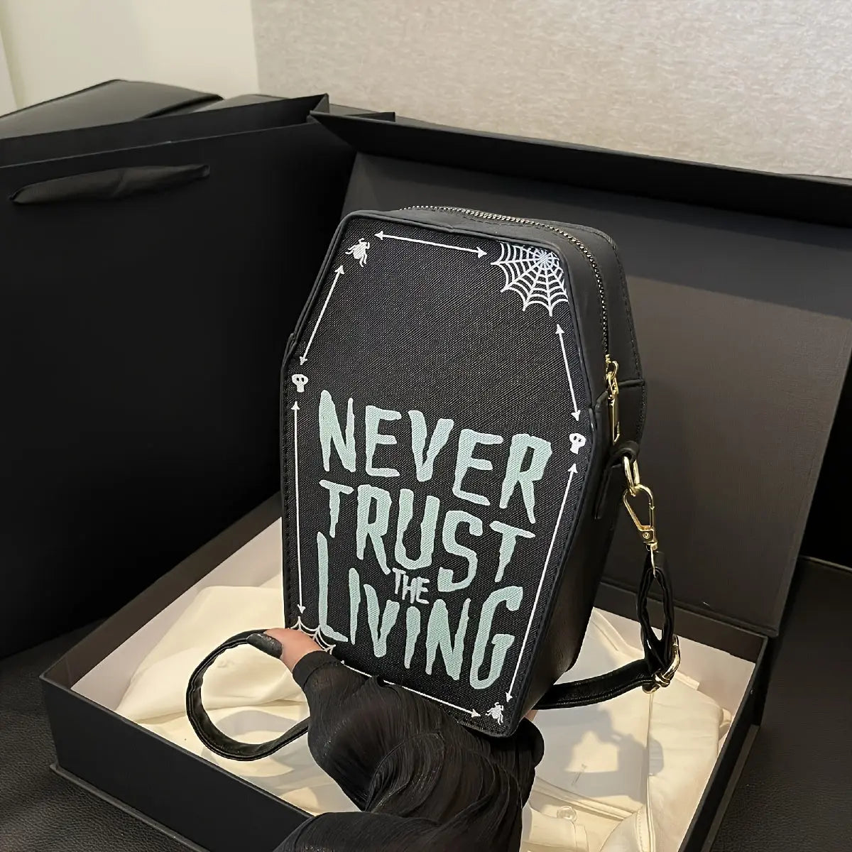 https://alittledisandat.com › products › gothic-coffin-crossbody-bag-with-slogan-and-spider-web-pattern1726409739426 variants10